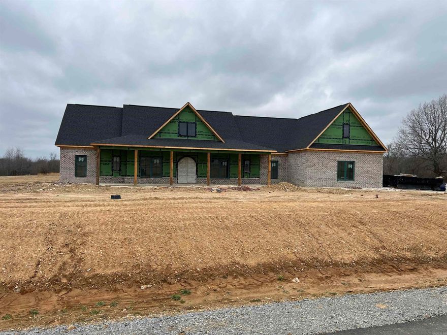 Beautiful home in a new secluded neighborhood with many mature trees.  The home sits on 1.0 acres and has plenty of room for a future shop and also a pool if desired. Sideloading 3 car garage with a storage/shop room off to the side.  This house isn't a custom but should be considered one with all the extras it has to offer: Built with zip system not regular OSB, Foam insulation, wood tongue and groove ceilings on all the porches, with a huge front porch that has 6 Real 10"x10" Cedar Posts, with a back porch to match that has an outdoor kitchen, and fireplace, includes a dedicated 1/2 bath for outside.  The interior has just as much to offer with an oversized island, stained and painted cabinets, accent walls, hidden pantry.  There is a dedicated room as an office, along with 4 bedrooms, separate dinning room, and 2 living areas.  Luxury Vinyl throughout the home, with built ins and superb finishing's.  Make your appointment today!