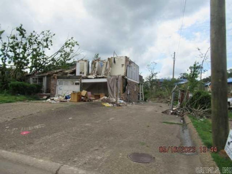 Tornado Damaged, Property will need rehabbed. Sold AS IS. located near W Markham and N Rodney Parham.  Hold Harmless document will have to be signed before showing. Agents see document on file and remarks.