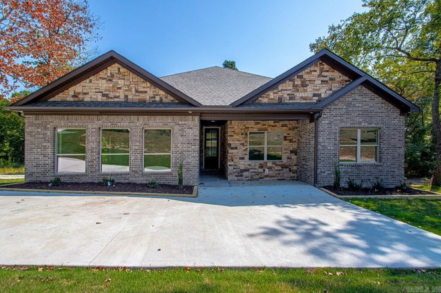 NEW CONSTRUCTION, Absolutely a beautiful brick 4 bedroom 2.5 bath house,  Outside the city, Country living but close enough to the city.  Large gently sloped  1.18 acre lot. Great exterior and interior design.  Huge Integrated covered deck. Basement/storage.  2 wood burning fireplaces, large den living area.  Great kitchen  Master bedroom separate from the other three.  Great floor plan.  Come take a look at this great home - What an Awesome house!.  Take a look today