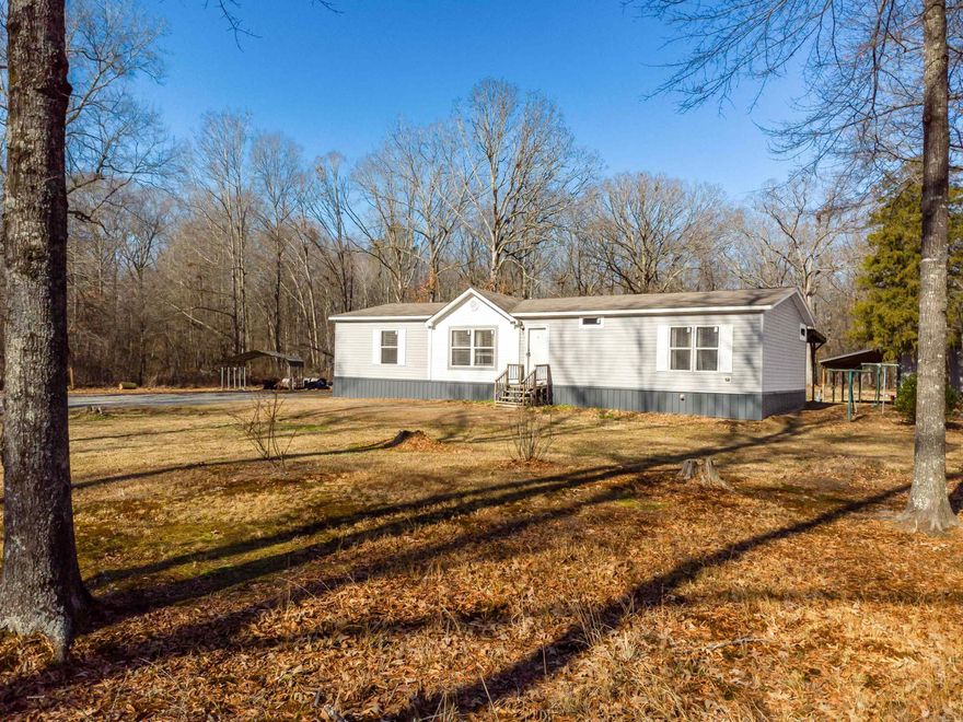 A Beautiful Open Concept - Newer 2016 Manufactured Mobile Home with LARGE walk in closets for each BR. This home sits on 5 acres with 3 being fenced in with electric gate. This property is ready for farm animals and/or gardening in the green house, has a shop with water and electric, 2 other storage buildings, metal carport, 15 Ft Round Above Ground pool with a nice porch running alongside the back length of the home. There is also an additional 5 acre track to the left that can be sold with this listing. Dont miss out on this beautiful place to call home.