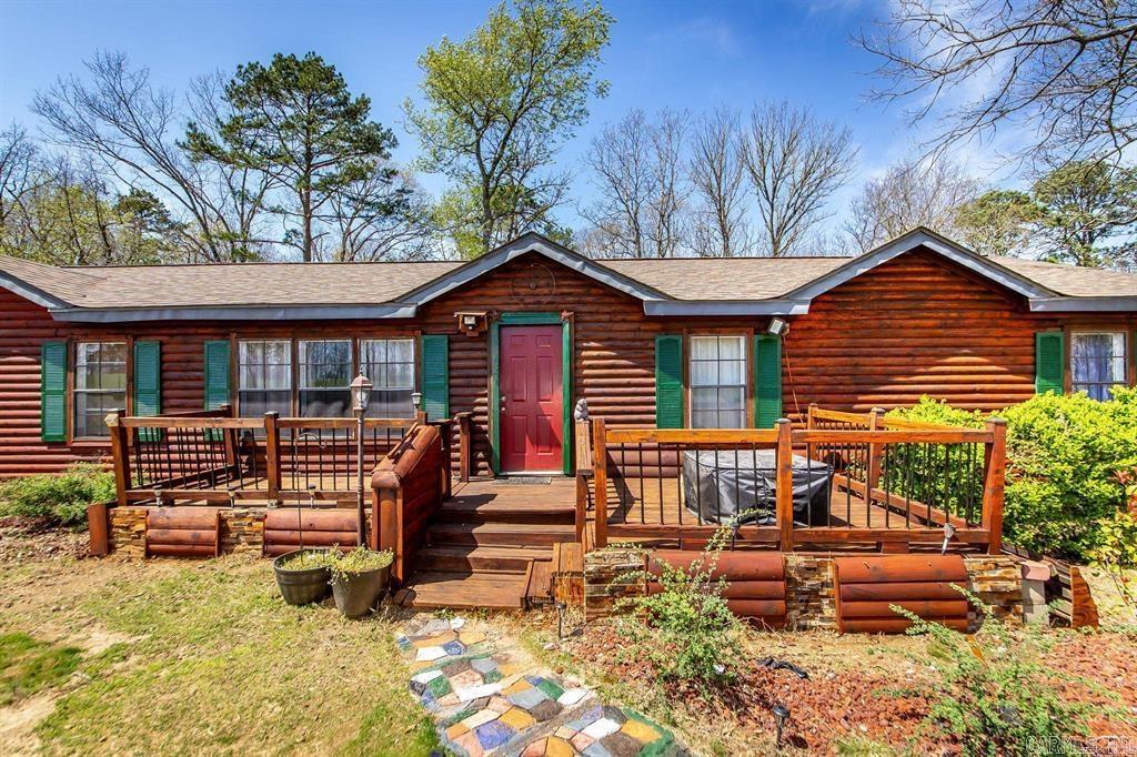 Nice Manufactured home has a log home feel and sits on a permanent foundation will qualify for 30 year mortgage. Sits on 3.72 private acres of land. Has a wet weather creek in the back yard. Home is a three bedroom two bath split floorplan. Has 2 living areas. Many updates and upgrades have been completed. New roof 3 years ago. Well has just been serviced. Call for more info