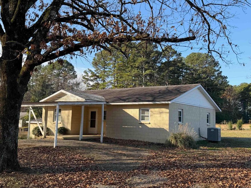 Located 5 minutes from everything and nestled on a quiet country lot shaded by beautiful mature trees, this move-in-ready 2-bedroom, 2-full-bath home proves you don’t need a lot of space to have it all. Ultra Low-maintenance and packed with the features most buyers want – all at an unbeatable price! Inside you’ll love the bright, open living area that flows right into the large kitchen everyone raves about. Tons of cabinet and counter space plus a huge walk-in pantry/laundry room combo with room for full-size washer and dryer and plenty of shelving. Two spacious bedrooms, two full bathrooms, newer HVAC for year-round comfort, and a safe in-ground storm shelter for total peace of mind. Step outside and the perks keep coming: •  Covered parking •  Detached garage/workshop •  Separate outside storage building •  Cozy BBQ and outdoor cooking area •  Small greenhouse – perfect for starting plants or year-round gardening With mature trees providing shade and privacy, this smaller home lives big and is truly turn-key. The big items are already done, so all that’s left is for you to move in and enjoy quiet country living.