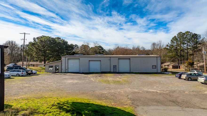 This impressive 5,495 square foot warehouse offers excellent visibility and prime highway frontage. Strategically located for maximum exposure, this property provides easy access to major transportation routes, making it an ideal space for a variety of commercial and industrial uses. The warehouse features a spacious open floor plans, high ceilings, and ample storage capacity, providing versatility to accommodate a range of operational needs. The site is equipped with two separately metered shop units, high bay doors for large vehicle access, generous parking space, and two office spaces ensuring smooth logistics and efficient operations. ***Post Automotive Lifts DO NOT CONVEY with property***