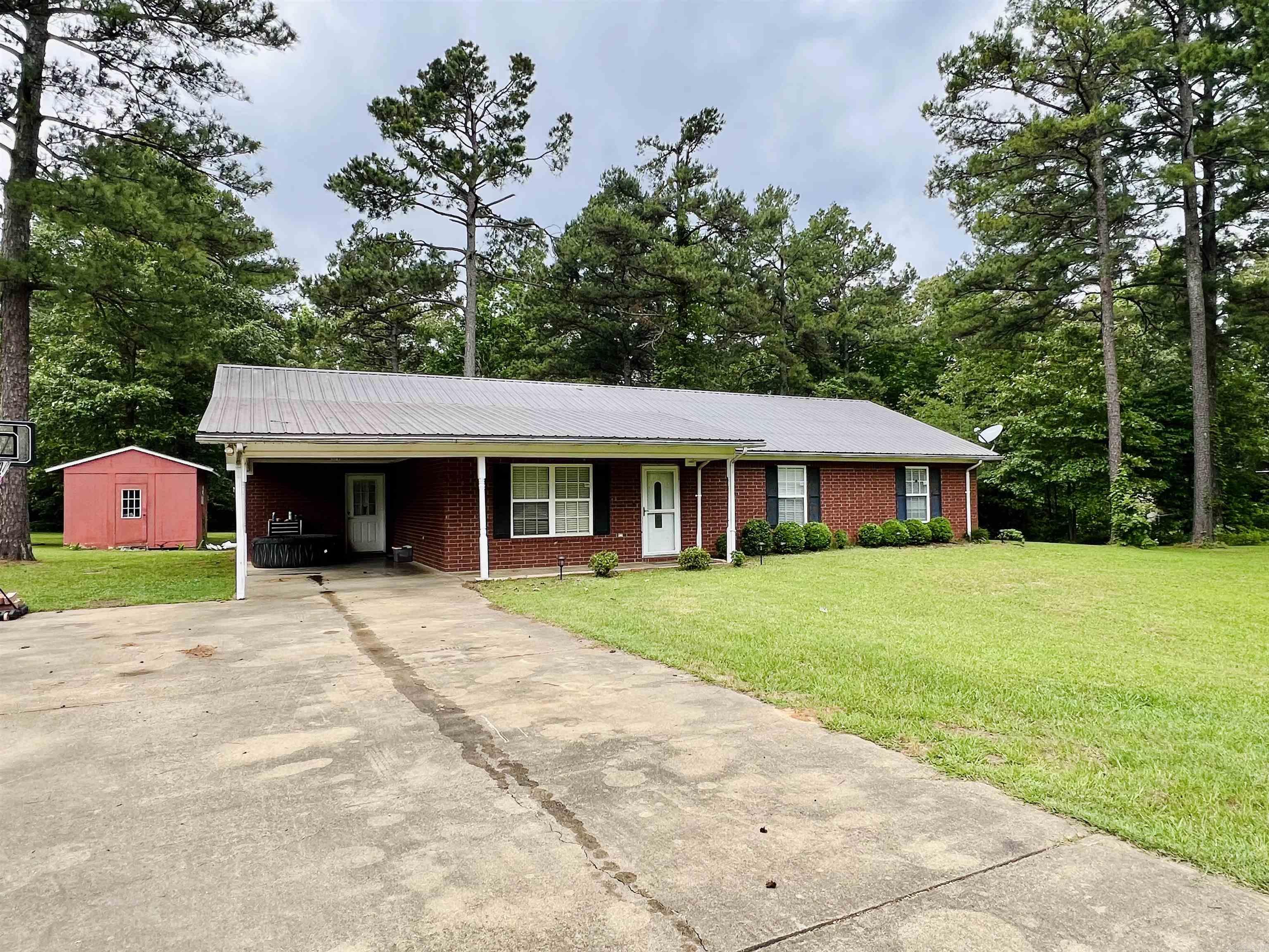 Cozy 3-Bedroom Home on Almost an Acre – Great Location! If you’re looking for space, comfort, and convenience, this 3-bedroom, 2-bath home checks all the boxes. Sitting on just under an acre (0.92), there's plenty of room to spread out—whether it’s for kids, pets, or just enjoying the outdoors. Inside, you’ll find a laundry room, a nice open layout, and updates that make life easier—like a new AC unit (installed Sept 2024) and a new hot water heater 1 year ago. This home also has a metal roof and carport. Pet owner? You’ll love the outdoor dog pen, already set up and ready to go. And with easy access to the highway, getting to work or town is a breeze. This home is move-in ready and waiting for you to make it your own!