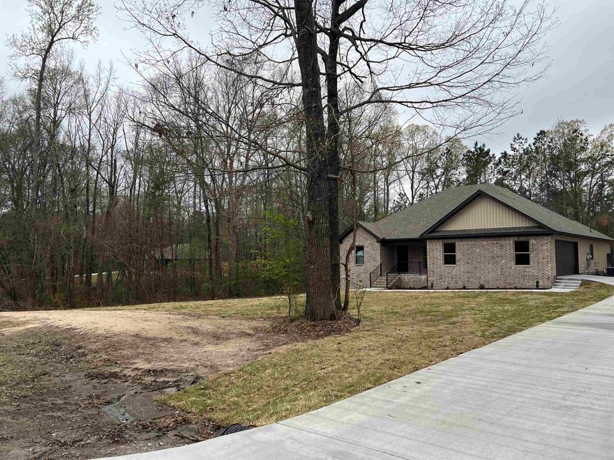 Beautiful home nestled up in the woods with lots of privacy. Located in a great neighborhood. 4 bed 2 bath. Open kitchen, dining and living room. 2 car oversized garage. Approx. 1 acre.