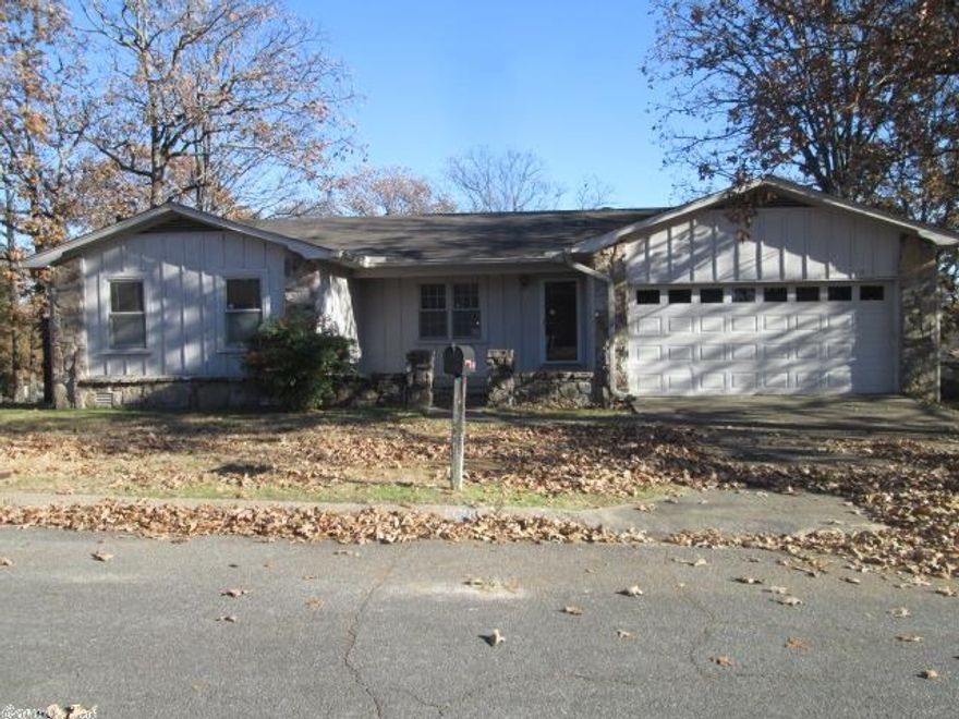 One story rock/frame exterior with two car garage. There are four bedrooms and two baths with hardwood floors in most of the home. there is access under the home that could be used as a storage space. Lots of space for growing family.