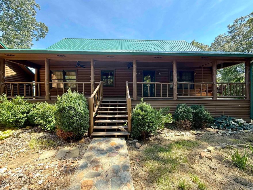 Charming 3BR Log Home on 6.93 Acres with Mountain Views, Walk-Out Basement & Safe Room  Enjoy mountain living in this 3BR, 2.5BA log home on 6.93 private acres with paved road frontage and a circle drive. This 3,360 sq ft retreat features a cozy gas log fireplace (1 yr old logs), walk-out basement, and whole-house Generac generator. The kitchen boasts a JennAir propane cooktop, double wall oven, and quiet-cycle dishwasher.  Relax on the covered front porch or spacious back deck overlooking an above-ground pool with stunning mountain views. Perfect for homesteaders or hobbyists with a metal barn, fenced animal area, 3-car detached garage, and RV hookup.  Inside, enjoy a walk-in tub, walk-in shower, and a dedicated safe room for added peace of mind. A new roof (1 year old) adds to the home's value and comfort.  Whether you're seeking a peaceful escape or a mini-homestead, this well-equipped mountain property has it all!