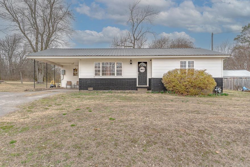 Welcome to market 180 College drive in Melbourne, Arkansas. This 3 bedroom 1 bathroom home boasts over 1100 sq feet of well laid out living space. It sits on a 0.4 +/- acre lot with an existing concrete pad in the backyard for the possibility to add a small shed, fire pit, kennels or so much more. The backyard has multiple opportunities to fit your needs. This home features recent interior and exterior updates and is ready for its new owners to make it their own. The 8x12 laundry room is right off the left side of the kitchen for easy accessibility. The eat in kitchen features ample cabinet space for the home and is right off the living area for  hosting and more. The bedrooms are all in close proximity to one another and the bathroom is situated in the middle for easy access. This home is equipped with a metal roof, carport for parking and is easily accessible just a little ways off E Main Street in Melbourne. It is located just seconds from Ozarka College and the city walking trail.  Call today to see this home!