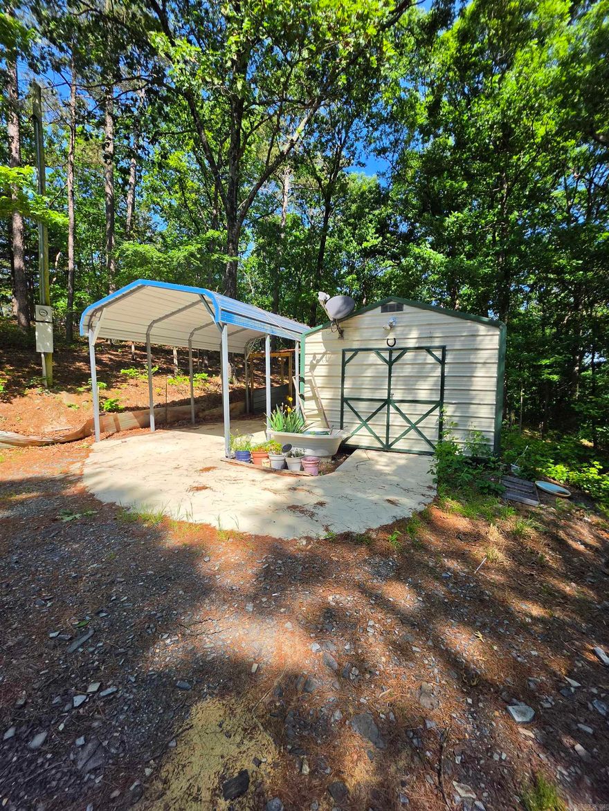 Peaceful country living awaits on this 3.4 acre wooded property featuring a 3 bedroom, 2 bath mobile home. Surrounded by trees, the land offers privacy and a natural setting, complete with a wet weather creek enhancing the charm of the property. The home offers a split-bedroom floor plan, open living area, and a functional kitchen. The primary bedroom includes an en-suite bath, while two additional bedrooms provide flexibility for guests, office space, or other hobbies. Enjoy relaxing mornings and evenings on the screened-in porch overlooking the wooded setting. Ideal for those seeking a quiet rural lifestyle, or simply enjoy nature, while still offering convenient access to nearby amenities.