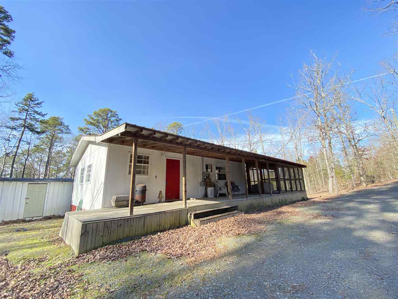Welcome to Market 75 Baseline. This a 2 bedroom 1 bath home with a huge screened in porch with wrapped around deck. It is a perfect getaway for lake cabin or starter home in the woods. Kitchen completely remodeled, Real wood floors, carpet in both bedrooms, metal room. Private area. What more could you ask for. Comes fully furnished including Washer and Dryer. Home may qualify for RD VA 0% Down, FHA 3.5%