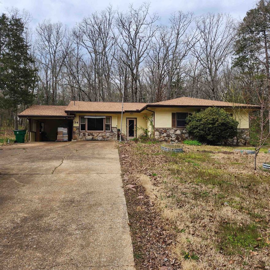 Great home in a great location. Very level front yard with several raised garden beds. This is a 2-bedroom home that can be a 3 or even a 4 Bedroom home depending on what you need. Fantastic Living room with bay windows and a skylight. The Foyer is so welcoming and inviting when you enter the home, It has a Jack and Jill bathroom. Lots of landscaping. An attached carport with storage and a detached covered parking area. Brand New Roof. Extra work area on back of house for small shop or storage and a separate storage building in the back yard.  Priced to sell.