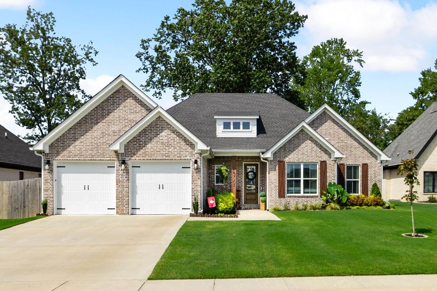 Experience timeless design and modern comfort in this stunning, less-than-three-year-old home in The Woods of Hurricane Lake Estates. From the welcoming front porch to the soaring ceilings with exposed beams, wood floors, and a gorgeous stone fireplace, every space feels refined and inviting. The chef’s kitchen showcases floor-to-ceiling cabinetry, quartz countertops, an oversized island, GE Profile appliances, and a generous walk-in pantry. The primary suite is a true retreat featuring wood-beamed ceilings, a soaking tub, an oversized walk-in shower with rain head, dual vanities, and a spacious closet with direct laundry access. Outdoor living shines with wooded views, a covered patio, extended 12x25 entertaining pad, built-in dog door, and a fully fenced yard. Beautifully landscaped and free of POA dues, this home offers luxury living in a prime location near Little Rock and I-30!