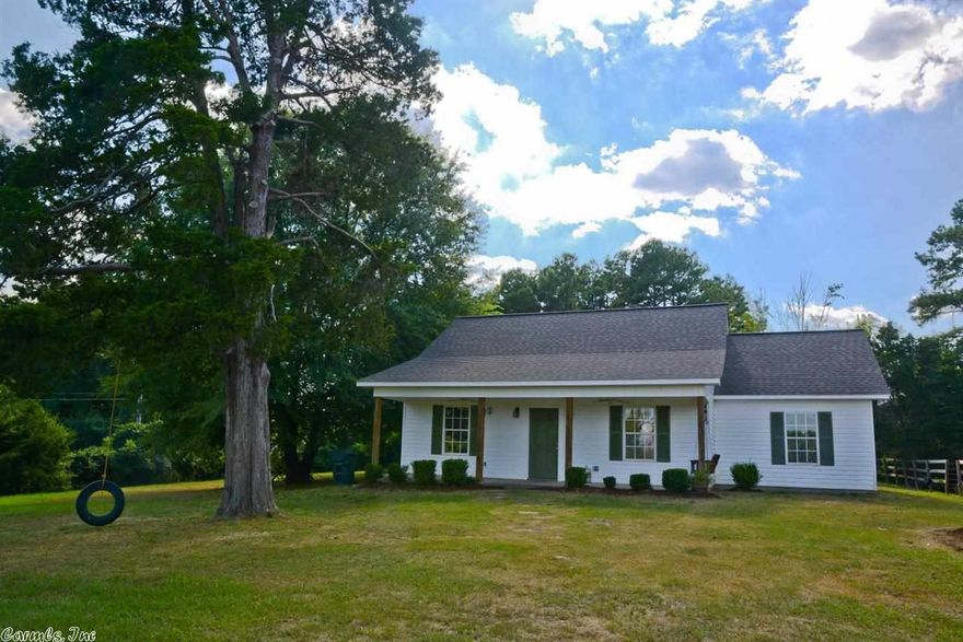 Charming home situated on 5 acres. Features an open floor plan and master suite that includes a nice walk-in closet. Property includes a large 864 sq/ft, 3 stall walk-through barn and tack room. Barn also has 240 sq/ft covered hay storage area on side. Property has fenced pasture land for grazing animals and extra wooded acreage in back. Front porch includes swing and view of land.  Additional 5 acres with large utility barn that includes enclosed garage is available for purchase under a separate contract