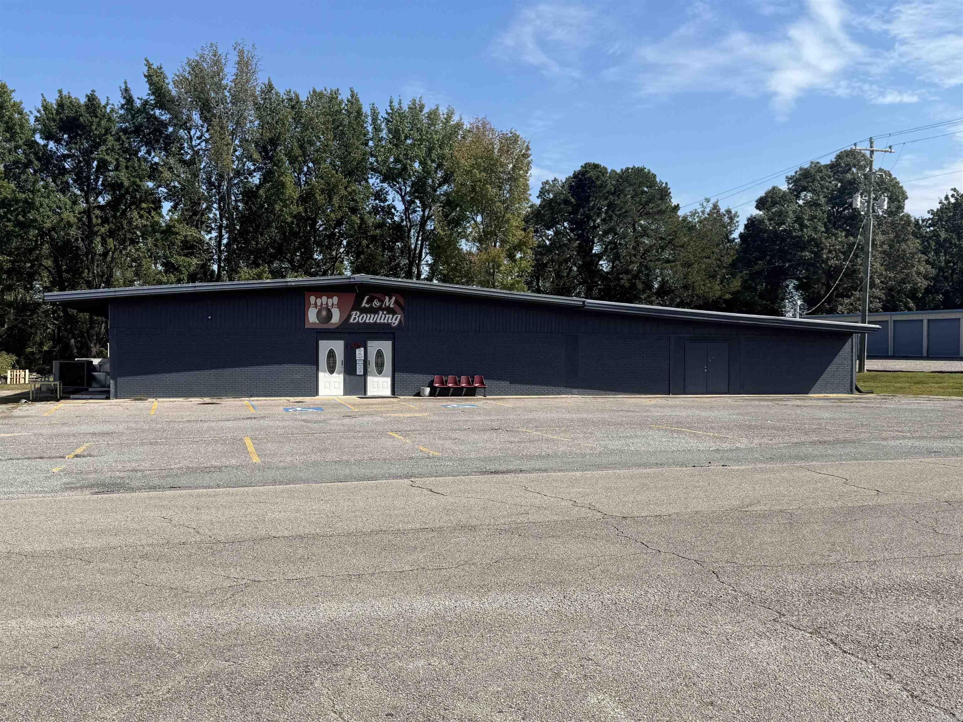 Wonderful updated commercial property with endless possibilities one block off of Highway 25B. The interior has over 10,000 square feet of heated and cooled space. The property is currently a fully functioning bowling alley with 8 bowling lanes, a 20x25 party room, a 30x40 arcade room, a small kitchen area with a pizza stove. Currently it has an additional 1,000-1,200 area that is storage but could be expanded for more arcade space or restaurant/grill and additional seating. It also has a 12x20 storage building in the back. Schedule your private showing today.