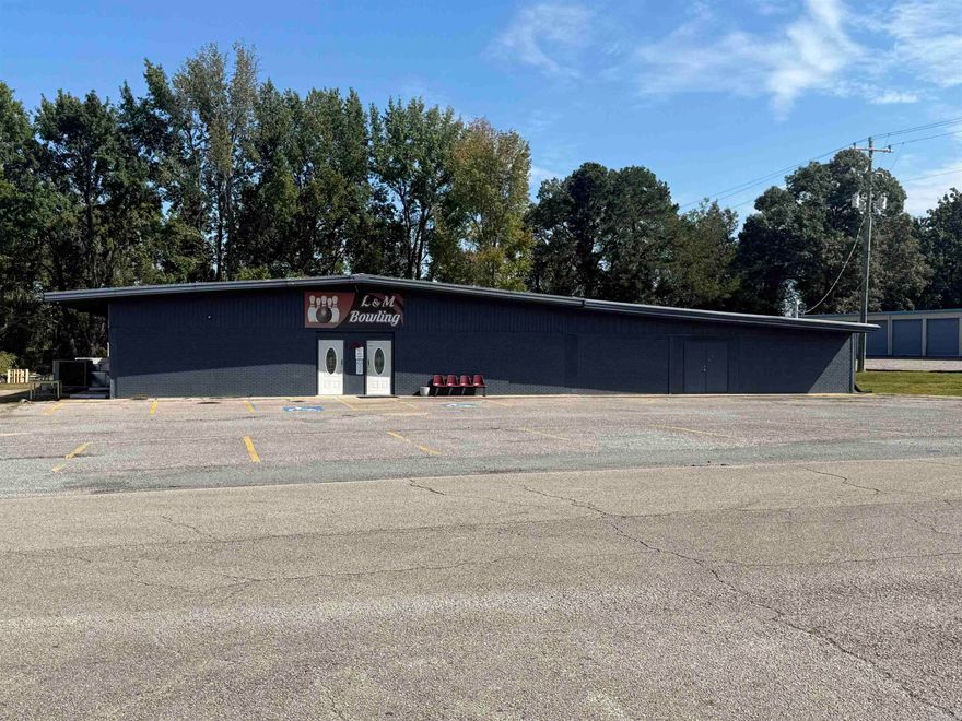 Wonderful updated commercial property with endless possibilities one block off of Highway 25B. The interior has over 10,000 square feet of heated and cooled space. The property is currently a fully functioning bowling alley with 8 bowling lanes, a 20x25 party room, a 30x40 arcade room, a small kitchen area with a pizza stove. Currently it has an additional 1,000-1,200 area that is storage but could be expanded for more arcade space or restaurant/grill and additional seating. It also has a 12x20 storage building in the back. Schedule your private showing today.