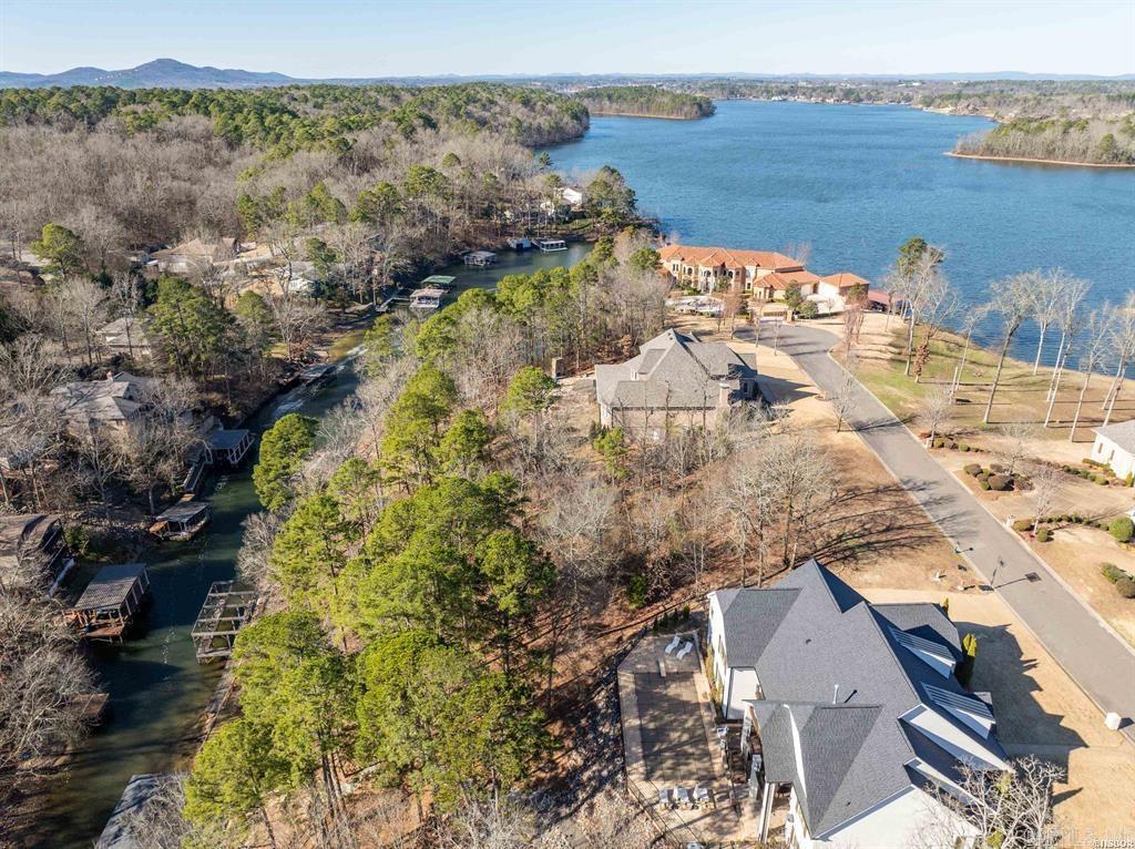 Build your dream home on this beautiful 120 feet of lakefront property! Enjoy serene views, tranquil surroundings, and direct access to the lake via the included boat dock. With house plans available, this ready-to-build lot offers the ultimate opportunity to create your perfect lakeside retreat. Don't miss out on this incredible chance to own a piece of paradise!