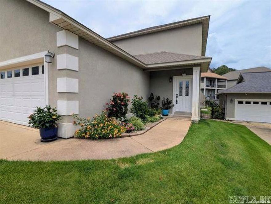 Looking for easy lake living? This well-kept home in the quiet, gated Lighthouse Cove community features great views of Lake Hamilton, a beautiful boardwalk, and easy water access. It’s perfectly set up for family and friends with 3 huge bedrooms, 3.5 baths, two separate living areas, and two covered decks. Plus, you get the peace of the lake while being under 5 minutes from the Central Ave Walmart!