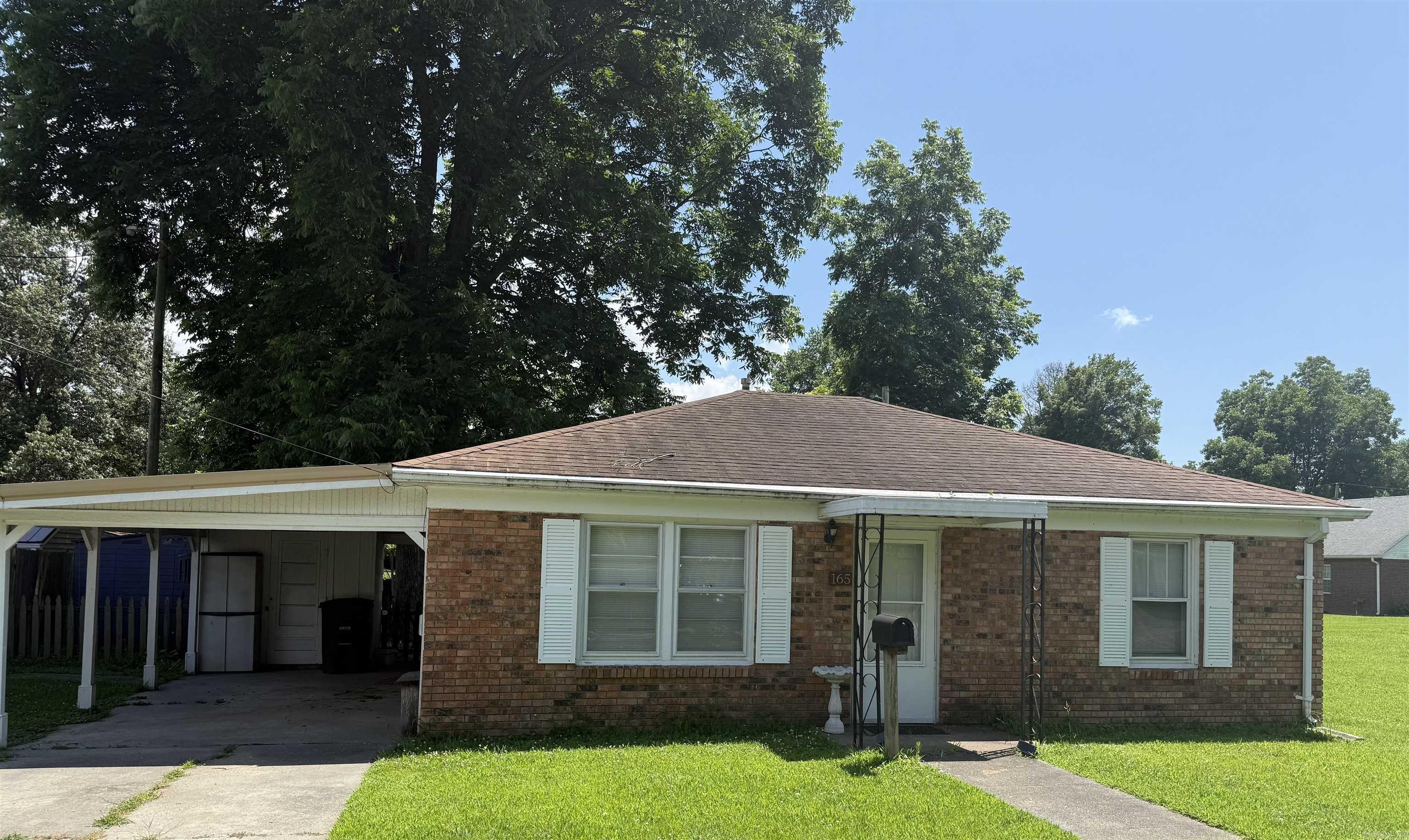 Charming two bedroom, one bath home in the heart of Piggott. Updated throughout, and move in ready. You will love the updated kitchen will large island, gas stove, stainless vent a hood, stainless refrigerator, decorative lighting, and pantry area. There's also a stackable washer and dryer in the Landry closet that conveys! Enjoy looking out the kitchen window while doing dishes, overlooking the spacious backyard with decorative fencing. The living area is open to kitchen area. The bedrooms are spacious and have large closets. The bathroom has a tub/shower combo and has updated vanity and lighting. This home is super nice and ready for new owners! Don't miss the opportunity to see this move in ready home with updates throughout and priced to sell!!! There's also a lovely patio area perfect for enjoying the outdoors, and just sitting underneath the shade tree. The backyard is very peaceful and you''ll love spending time outdoors, grilling out, and relaxing with family and friends. Call TODAY YOU WILL WANT TO SEE THIS ONE!!!