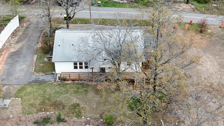 Hill top beauty two bedroom has room for a third bedroom .Home has many updates. Beautiful Hardwoods large rooms newer windows Slab Granite Countertop in the kitchen area refrigerator remains with the home at no value. Seller is leaving the washer and dryer also at no value. Has new hpt water tank. Seller is including Lot at 4609 E. Reed Rd  0.47 acre more or less in the sale. Seller is having a new survey done including both properties. Home also has a storm shelter.