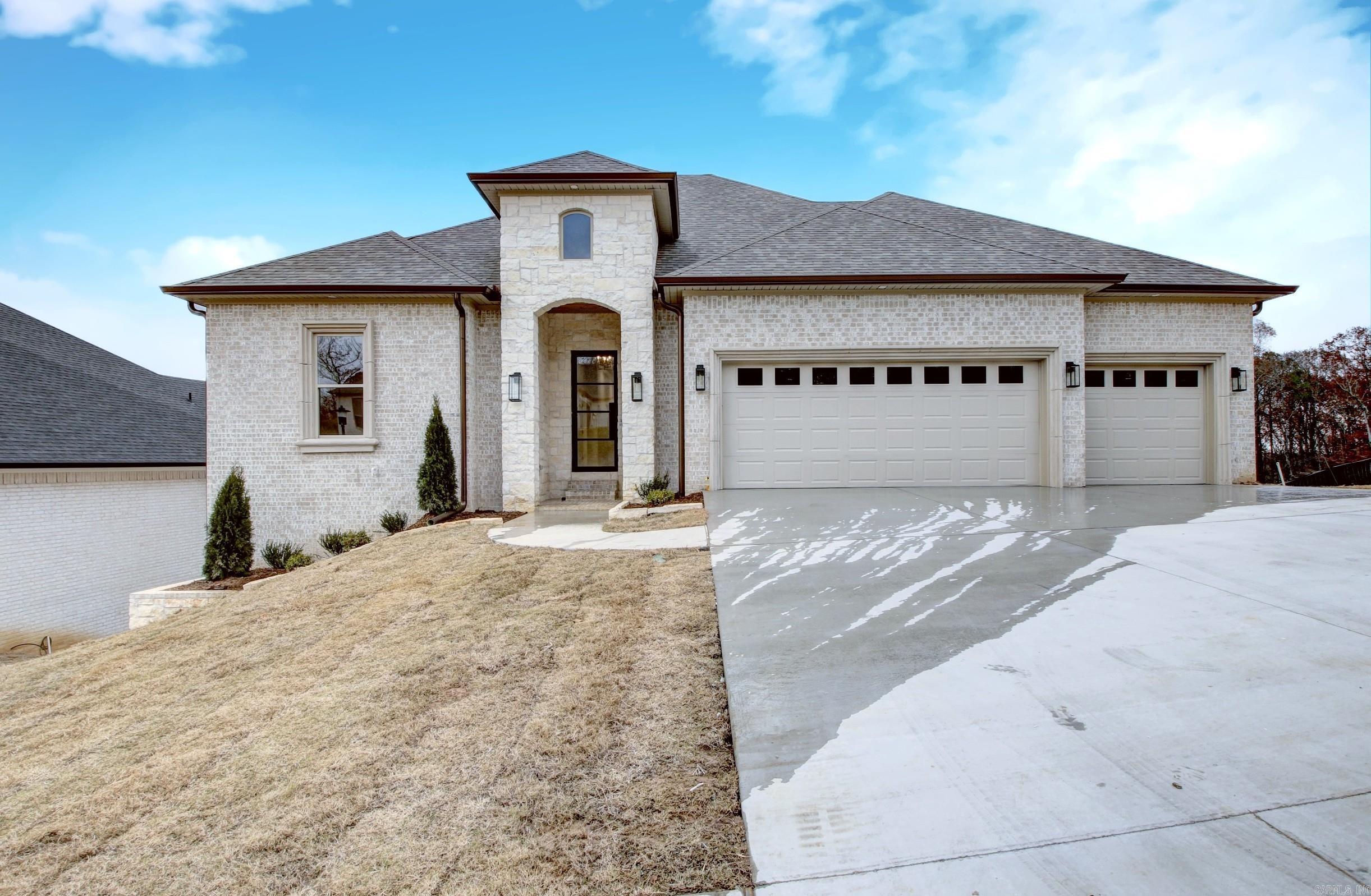 Just reduced! Builder is motivated!! Luxury home in Maumelle Valley Estates with features designed for comfort & elegance. This home features 6 bedrooms, 4 baths and 2 living areas, designed in a split-to-the-rear style. This layout offers privacy & a seamless flow between different living spaces. The open floor plan enhances the living room, dining area, & kitchen, facilitating easy interaction during gatherings or family time. A gourmet's delight with quartz countertops, a large island, built-in trash bend, pull-out drawers, Cabinets are soft closing, and a gas cook top range, Butlers Pantry to die for with microwave!! Primary bathroom includes a spa soaking tub, separate vanities with ample storage, large walk-in closets, and a built-in chest for added convenience. Luxury Vinyl Plank flooring (LVP) graces the upper living space for durability & aesthetic appeal, while carpet in the bedrooms downstairs adds comfort. Enjoy multiple decks, with the top deck offering picturesque views and a fireplace, perfect for entertaining or relaxing amidst greenspace. This home promises a blend of luxury, functionality, and natural beauty in a sought-after location! Call for your showing today!