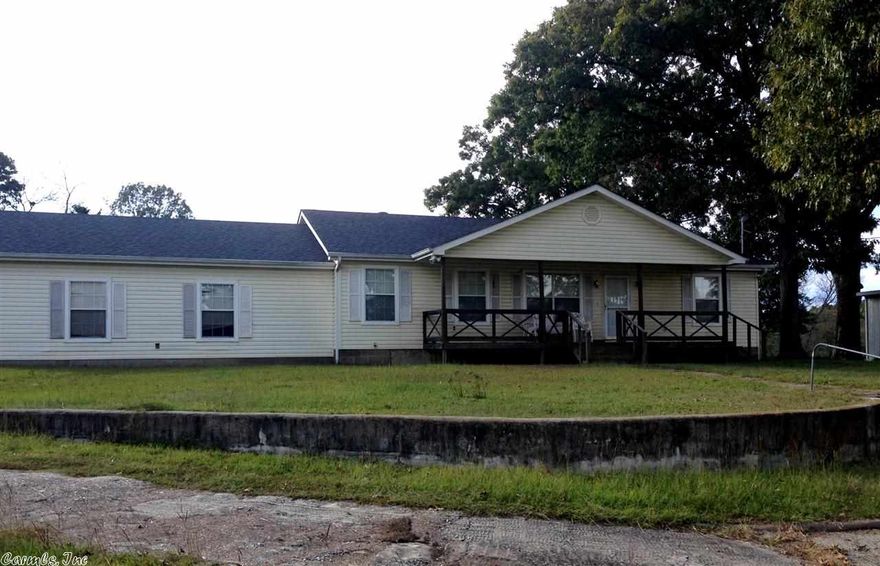 Looking for a country feel in a super location?  Great opportunity to own 10 acres and a nice house built in 2000.  This Lake Hamilton Schools home has a split floor plan, open living area, huge garage (832sf), front porch and a little fenced yard in back for the pup. Brand new roof and 1 yr old Trane HVAC, 16X24 storage building, a 20X24 pole shed, mature oaks and vista views add to the package.  The home sits far from Walkway Dr. and a new subdivision of nice homes is going in across the street.