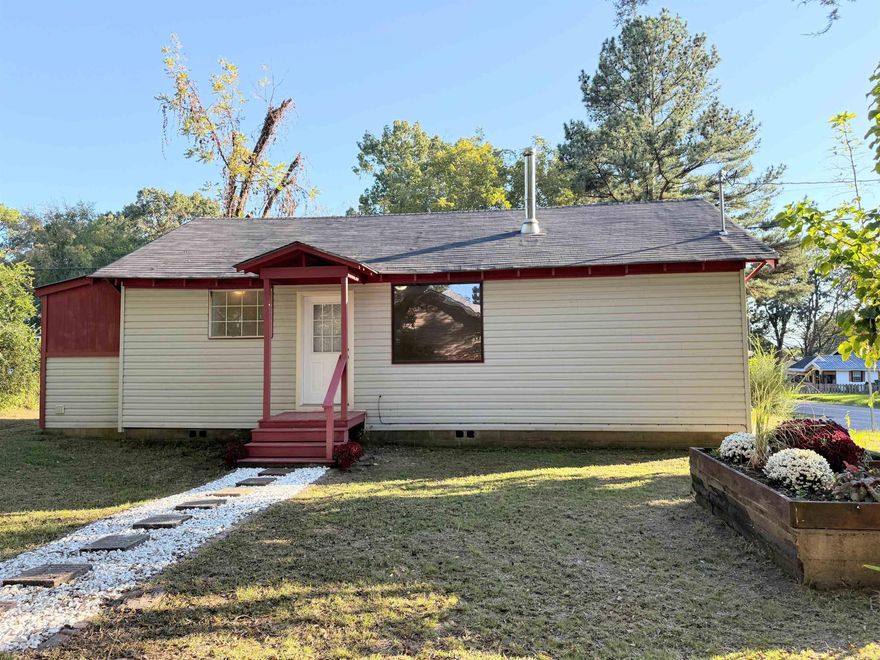 Completely remodeled three-bedroom, two-bath home situated on a corner lot. This property features beautiful hardwood flooring in the spacious living room accented by a cozy fireplace. The interior offers fresh paint throughout, new kitchen cabinets, and a new roof. Move-in ready and thoughtfully updated, this home combines charm, comfort, and convenience.
