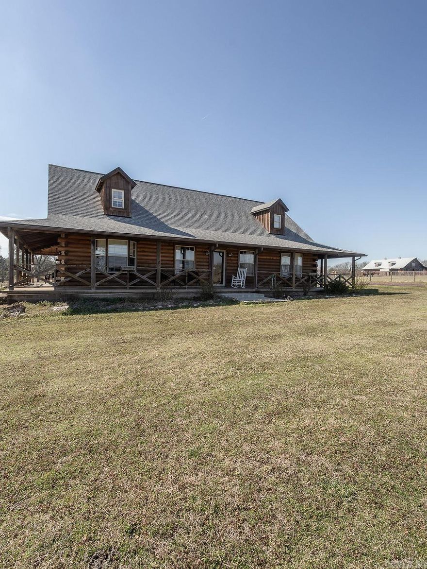 *****Security dog on Property******* Modern Log home with 4 Bedrooms and 3 full Baths and a loft overlooking the living area.  New custom Kitchen with solid surface counter tops. Beautiful farm setting with 4 ponds.  Great Pasture.  Fully fenced for live stock.  Do not go into pasture with out talking to owner agent due to Bulls in pasture.  Stocked main pond with Croppie, Catfish and Bream.   Eagles fish in ponds.  13.5x30x60 Shop that has motor home Hook ups and is plumbed for a washer and Dryer this property can be  purchased with the back acreage and the front home 7301 Fairplay