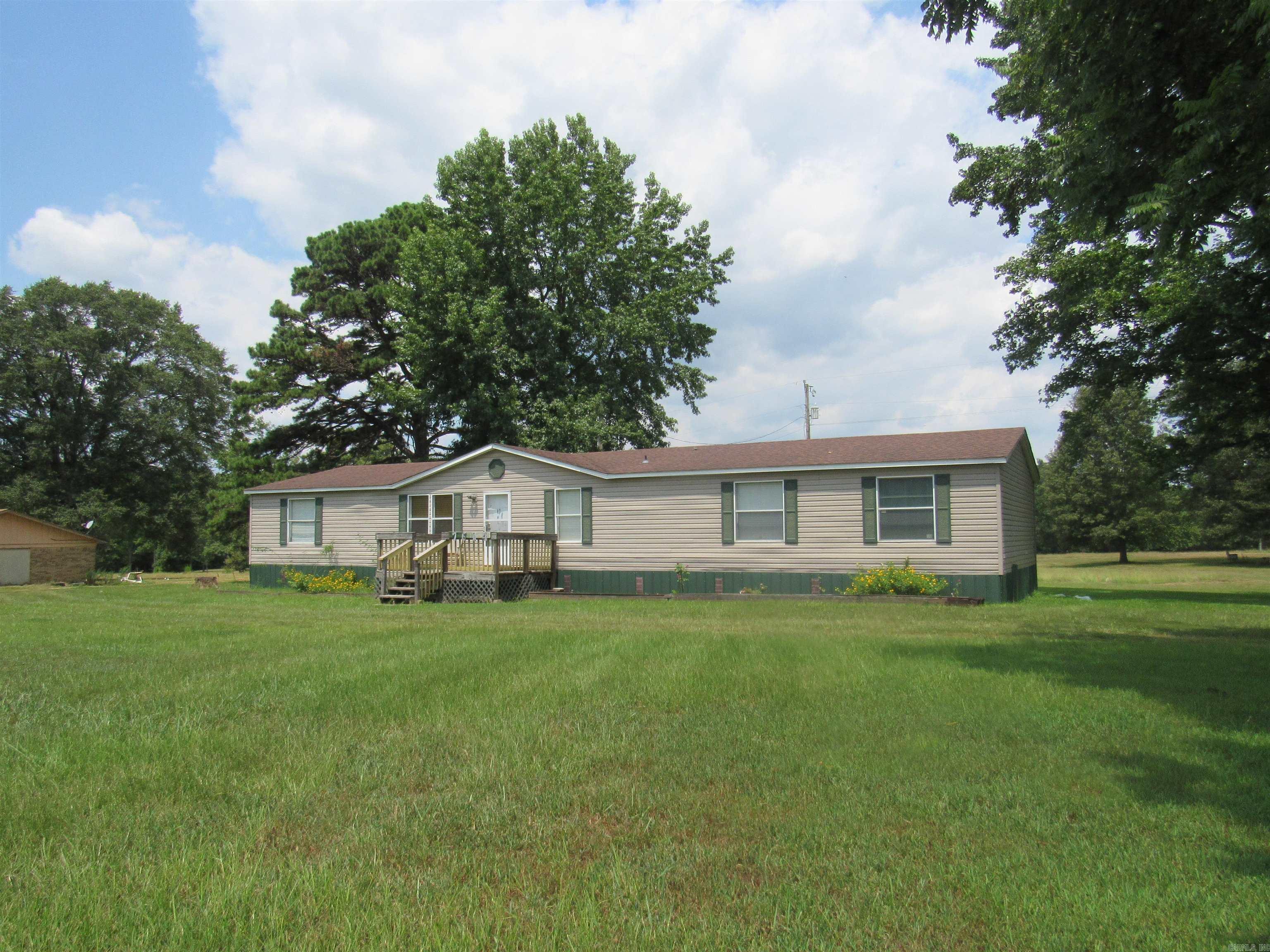 Spacious 5-Bedroom Home on 1 Acre Welcome to this well-maintained 2007 double-wide mobile home, offering 1,872 square feet of comfortable living space. Situated on a peaceful 1-acre lot, this property combines functionality, privacy, and plenty of room to spread out. Inside, you'll find 5 spacious bedrooms and 2.5 bathrooms, along with both a living room and a large family room ā perfect for entertaining or relaxing with loved ones. The open kitchen and dining area provide a great layout for daily living and hosting. Step outside and enjoy the fresh air from either the front porch or the covered back porch, ideal for relaxing in the quiet of the countryside. The home runs on well water (now-will be county switched soon) offering added utility savings and rural convenience. Whether you're looking for room to grow or simply want a peaceful place to call home, this spacious property has it all. Call us today for your application and tour!