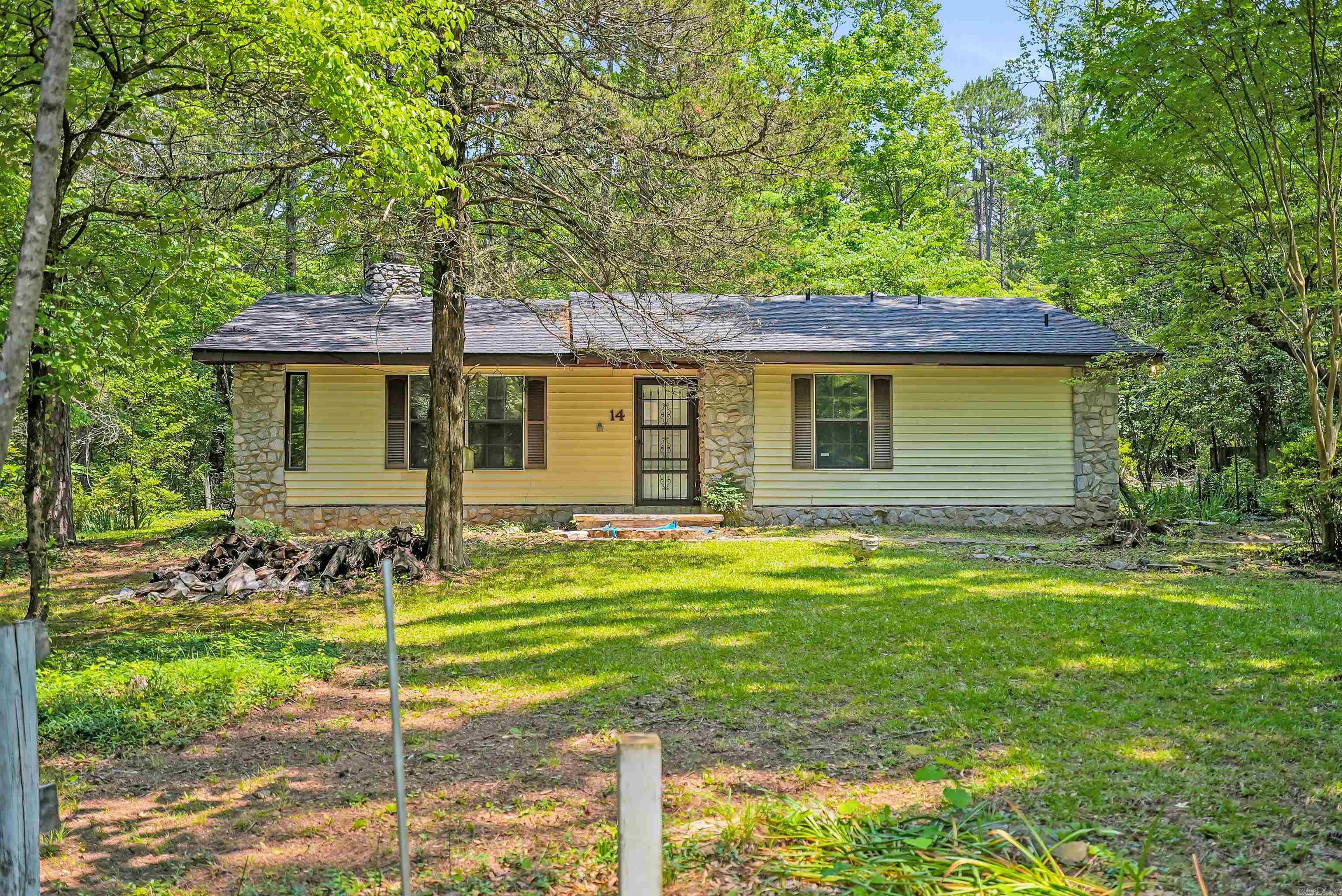 NEW Roof, NEW Paint, NEW LVP Floors, NEW Water Heater! Charming 2-bedroom, 2-bathroom home nestled in a peaceful neighborhood! Perfectly situated just one minute from Highway 65, your commute will be a breeze. This home offers a spacious 0.95-acre lot, providing plenty of room for outdoor activities and future expansion. The property features an ADDITIONAL ROOM, ideal for transforming into a 3rd bedroom, craft room, or storage space to suit your needs. With mature trees throughout the subdivision, you’ll enjoy sightings of local wildlife like squirrels and deer, adding to the serene ambiance. This lovely home has tons of character and potential—just waiting for the right owner to give it some additional TLC and bring it to full glory. On Conway Corp utilities. Square footage obtained from Tax Records. Measuring is recommended. No seller property disclosure. Call/text to schedule a tour! Agents see remarks.