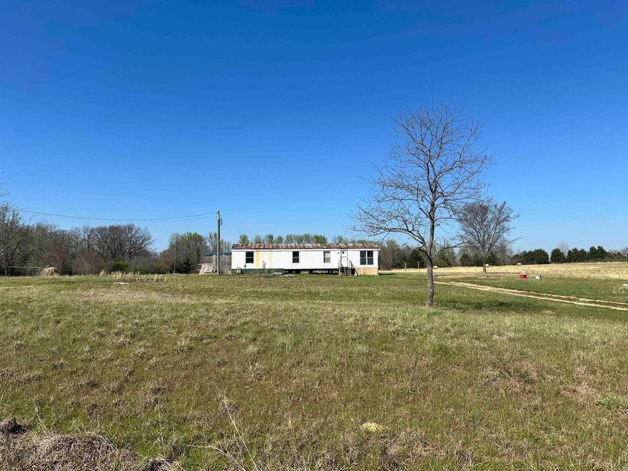 This 8-acre property in Allen Mountain Estates is mostly cleared with a few scattered trees. It is all level and usable land with water and electric in place for the 2-bedroom mobile home. About 4-acres is being used for hay and it is fenced on two sides. It has county road frontage with a fire station only two lots down. The deer are plentiful and some really big bucks roam this area.   If you are ready to get away from the hustle and bustle of the city this is a quite, peaceful place with incredible sunsets. It is conveniently located just 8-miles from Pangburn and 12-miles from Searcy.  Schedule your showing today. Call Marty Sikes @ 501-450-0963