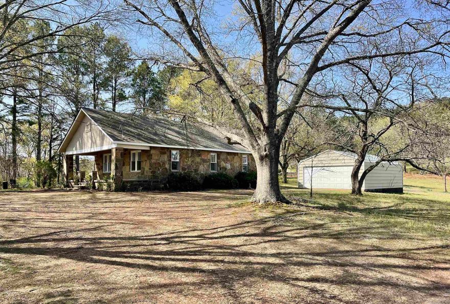Originally built in 1935, this 3-bedroom, 1-bath farmhouse has undergone a stunning remodel while maintaining its classic charm. With 1,061 sq. ft. of bright, open living space, the home is filled with natural light from its many windows. Enjoy a 216 sq. ft. front porch, a 155 sq. ft. enclosed back porch, and a spacious 30' x 22' garage with electricity and a concrete floor. The large tree-covered lot provides ample space for a garden, outdoor activities, or even small livestock. Located on a paved county road with fiber optic internet, rural water, and electricity, this home offers both charm and modern convenience. Appliances—including an electric range, two refrigerators, and a washer/dryer—stay with the home. Minutes from the Greers Ferry Lake, Little Red River, Ozark National Forest, Fairfield Bay and endless outdoor recreation!