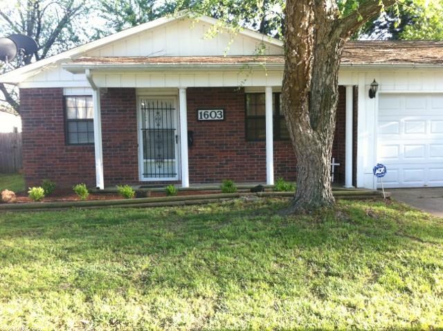 Very nice home with new wood laminate flooring throughout, pretty ceramic tile in the kitchen laundry and bathroom. Lots of cabinets in the kitchen, stainless appliances, tile countertops, pantry, storage cabinets in the laundry, great size living room with lots of windows in this house. Blinds on all the windows, storage room in the attached garage, wired shop in the fenced in back yard with a drive gate on the side. Also has a huge covered back patio, fire pit, nice trees, storm cellar & side parking spot