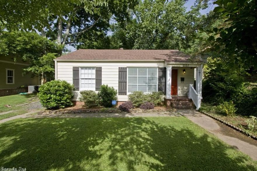 Cute updated Hillcrest cottage.  Hardwood floors.  Nice kitchen with natural stone countertops and backsplash. Second living space with renovated bathroom, and laundry room.  Fantastic deck and brick patio, large privacy fenced backyard.  Outdoor storage.