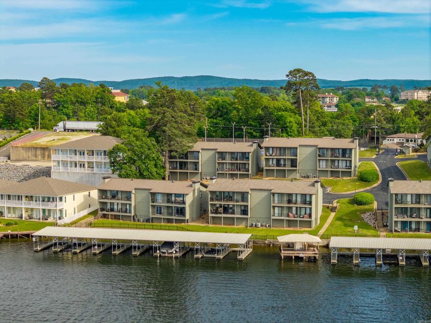 Amazing views of beautiful Lake Hamilton and mountains from this 2 bedroom 2 bath condo at THE LANDING. New kitchen and bath updates, Heat & AC is a couple years old, new hot water heater, new flooring in bedrooms and fresh paint! Selling fully furnished except for the patio furniture on back porch. This complex allows for STR and is located close to shopping, restaurants and Oaklawn Casino.Unit is across from pool and new pickle ball court. Complex has a great boardwalk on the lake. Boat slip does not come with this unit but there is one in the complex that can be purchased separately.