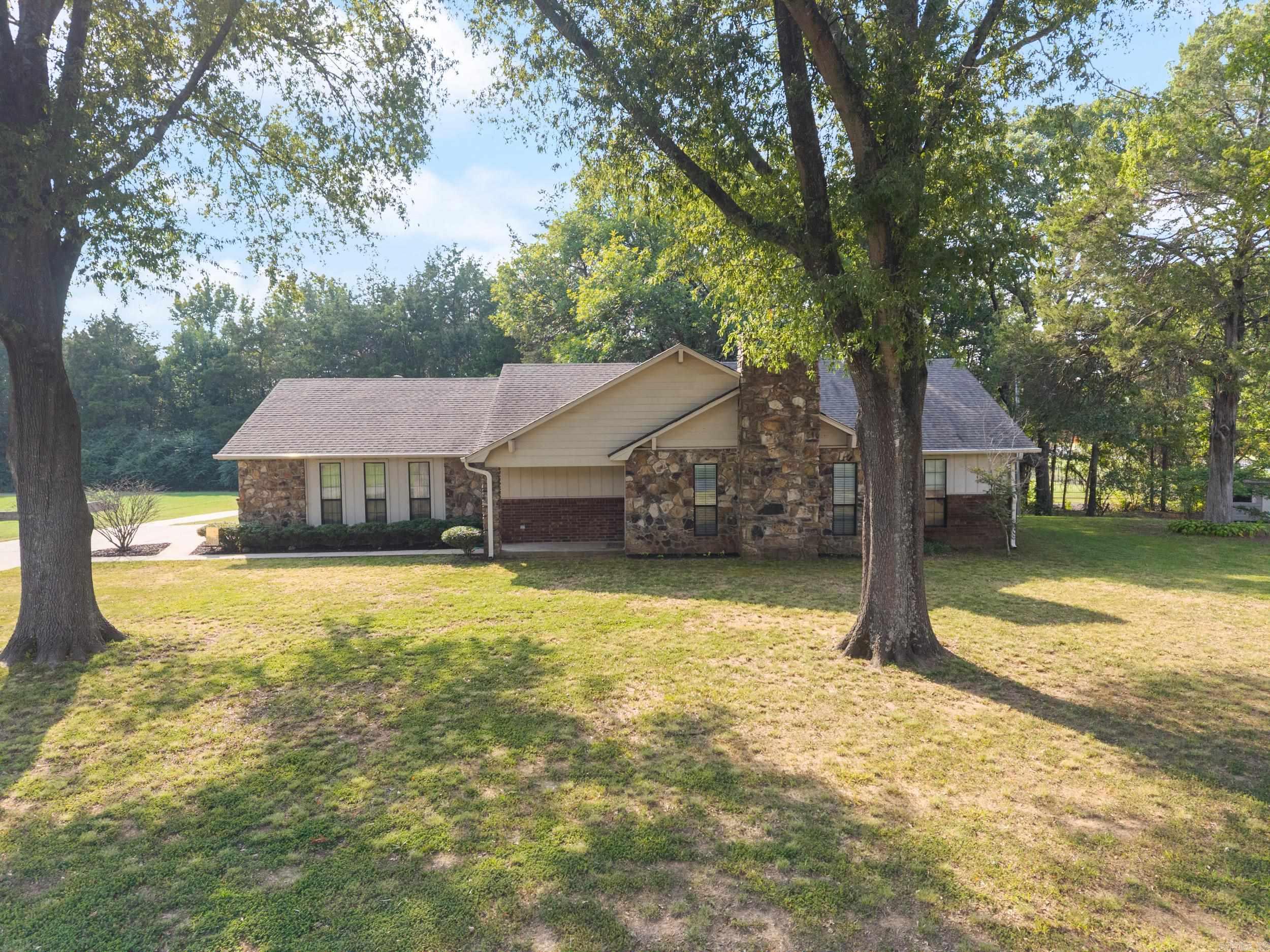 Welcome home to this spacious West Conway beauty that truly has it all! Step inside to a large living area centered around a stunning stone fireplace, perfect for cozy evenings. The home features a generous dining room, a large functional kitchen, and a large laundry room with a convenient half bath. The oversized primary suite includes a huge walk-in closet with custom built-ins, while the additional bedrooms offer deep closets with built-ins for extra storage. Enjoy outdoor living on the shaded patio overlooking the mature tree-lined lot that helps keep utility costs low. Need workspace or storage? The property includes a fantastic shopāfully insulated, equipped with electricity, a mini split, and a double carport ideal for your boat, trailer, or extra vehicles. With a side-entry garage and thoughtful details throughout, this home combines comfort, function, and value in one perfect package. You must see this beauty in person!