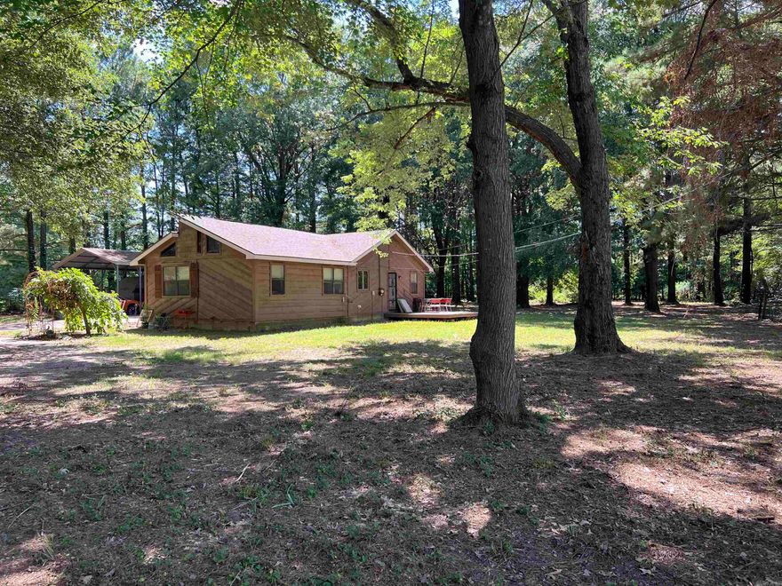 Country Oasis just a short drive to town.  You will not want to miss this move in ready, very loved for home with 2 +/- acres.  This 2 bedroom 2 bath home is packed with updates, LVT flooring, updated appliances, new countertops and painted cabinets, new bathroom vanities and a nice shop! The living room features lots of natural light during the day and enjoy the full moonlight at night. Beautiful wood beams run across the room giving you that warm homie feeling.  Call today before its gone!