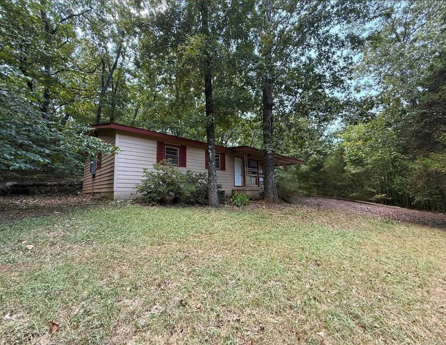 3 Bedroom Home in Cherokee Village, Close to the Lake! This 3-bedroom, 1-bath home is ready for new life and a fresh start. It offers a carport, partially fenced yard, and a convenient location near the lake. The home does need repairs and updating, but with some work it has the potential to become a comfortable residence, vacation getaway, or investment property.