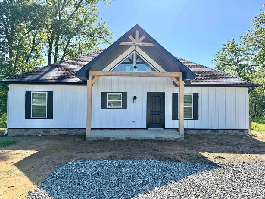 New construction on the Little Red River with a private boat dock! This beautiful home is nearing completion and is expected to be finished within the next few weeks.  The home features a desirable split floor plan designed for comfort and privacy. Enjoy river views from the spacious living room and the primary suite, both offering French doors that open onto a large covered back porch overlooking the water and your private boat dock.  Inside, the home is designed with gatherings in mind. The spare bedrooms include built-in bunk beds, making it perfect for hosting family and large groups. Whether you're looking for a full-time residence, weekend getaway, or investment property, this riverfront home offers the perfect setting for relaxing and enjoying life on the water.