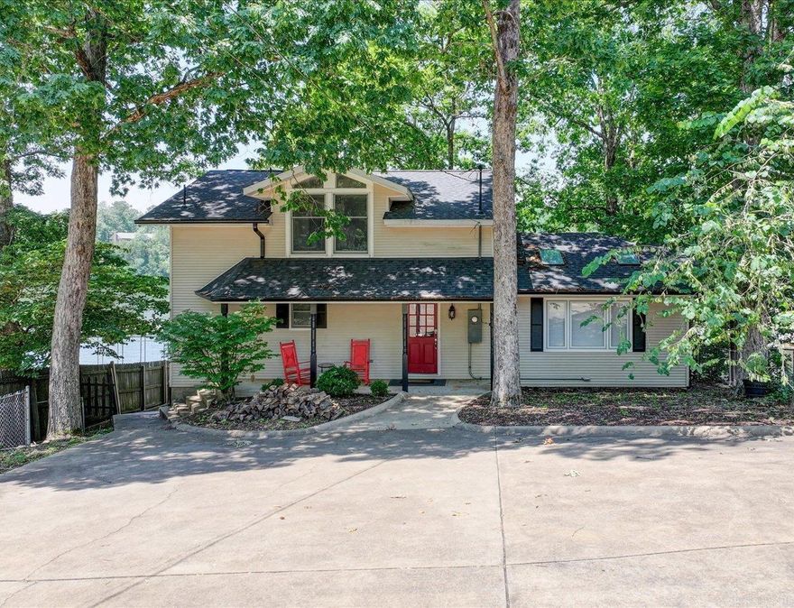 BEAUTIFUL MOVE-IN READY LAKE HOUSE WITH INCOME POTENTIAL!  Welcome to your ideal lakefront retreat! This beautifully remodeled 3-bedroom, 3.5-bath home is fully furnished and ready for you to enjoy. With a double boat dock, boat lifts, swim dock, spacious lower deck, and a brand-new hot tub (2024), this home is perfect for lakeside living and entertaining. KEY FEATURES & UPGRADES: - 2021 Remodel – Finished basement with full bath, remodeled main, half, and upstairs bathrooms, new carpet, and full interior repaint - New A/C in 2022   - New Water Heater in 2023 - All new appliances in 2021, including TWO sets of washer/dryers - New Deck in 2021  - New Retaining Wall in 2024  - All furnishings purchased new in 2021 Spacious main level has open living & dining, vaulted ceilings, skylights, and lake views. Kitchen has butcher block counters, stainless appliances, breakfast bar, and deck access. Primary suite has king bed, en-suite bath, and washer/dryer. Upstairs has 2 king bedrooms and an updated bath. Lower level has bunk/game room, sleeper sofa, and a full bath. See Agent Remarks for STR Income. Agents - Call Showing service to schedule all showings.