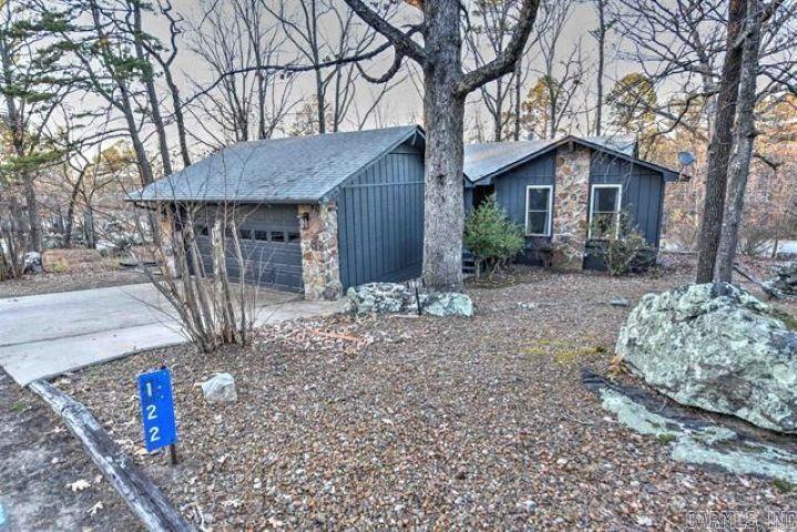 Welcome home to this charming 2-bedroom, 2-bathroom house! This property has everything you need, including a cozy living room with a wood-burning fireplace and a screened-in porch surrounded by beautiful trees and nature—perfect for unwinding after a long day at work. Inside, you'll find two spacious bedrooms, each equipped with a ceiling fan for your comfort. The bathrooms feature convenient walk-in showers. The exterior of the home showcases a lovely iron-gray color with stone accents, along with a 2-car garage that offers extra storage. This home is perfectly located near all the amenities Fairfield Bay offers, so schedule a visit today; it won't last long!