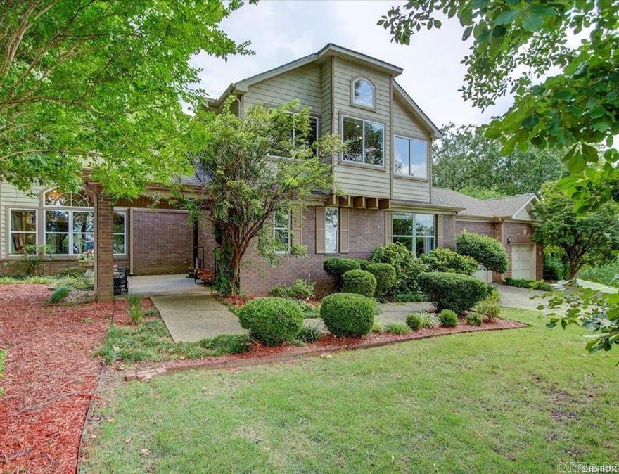 This exquisite gated Stonegate Shores 4 bedroom, 2.5 bathroom residence offers serene lake and mountain views ,Step inside this light and airy contemporary home to discover an open floor plan designed for modern living with soaring ceilings and 3 fireplaces. The spacious living area is bathed in natural light, creating a warm and inviting atmosphere. The gourmet kitchen, equipped with top-of-the-line stainless steel appliances, sleek Corian countertops, and a large island, is perfect for both everyday meals and entertaining guests. Retreat to the luxurious master suite, which features a private courtyard, a beautiful ensuite bath with double-sided fireplace, beautiful shower with waterfall showerhead and body spray nozzles Jetted tub & walk-in closet. The additional three bedrooms are generously sized and share a well-appointed full bathroom, providing ample space for family or guests .Outside, the covered deck with television and expansive patio  are perfect for al fresco dining or simply relaxing while taking in the breathtaking views of the lake and mountains. The meticulously landscaped yard offers both beauty and privacy, enhancing the outdoor living experience. Additional fea