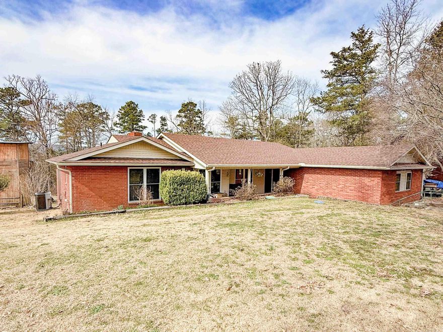 Welcome to the Market! Enjoy lakeside living in this beautiful brick home on the shores of Greers Ferry Lake. This spacious 4-bedroom, 2-bath home offers 2,470 sq ft of comfortable, open-concept living—perfect for family gatherings or hosting friends. Inside you will find a large kitchen with new granite countertops and backsplash, new carpet in the bedrooms, and fresh upgrades throughout, including a new roof, windows, and gutters and decking. The large laundry room adds convenience, while the separate master suite provides privacy and comfort. Relax by one of two fireplaces, or unwind in the screened-in porch overlooking the large backyard with an easy walk to the water. Located just 4 minutes from Devil’s Fork Boat Ramp and 2 minutes from the Narrows Boat Ramp, this home is ready for lake season—don’t miss your chance to see it!