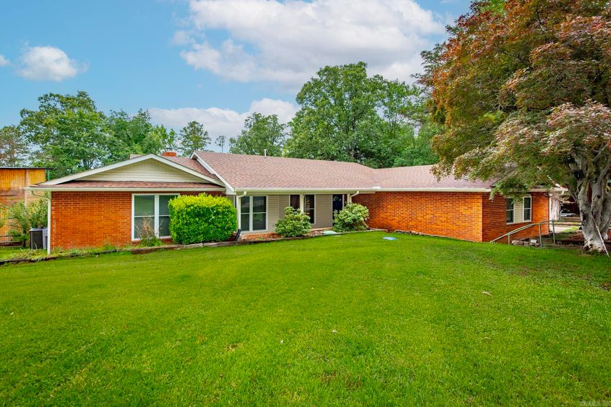 Welcome to the Market! Enjoy lakeside living in this beautiful brick home on the shores of Greers Ferry Lake. This spacious 4-bedroom, 2-bath home offers 2,470 sq ft of comfortable, open-concept living—perfect for family gatherings or hosting friends. Inside you will find a large kitchen with new granite countertops and backsplash, new carpet in the bedrooms, and fresh upgrades throughout, including a new roof, windows, and gutters and decking. The large laundry room adds convenience, while the separate master suite provides privacy and comfort. Relax by one of two fireplaces, or unwind in the screened-in porch overlooking the large backyard with an easy walk to the water. Located just 4 minutes from Devil’s Fork Boat Ramp and 2 minutes from the Narrows Boat Ramp, this home is ready for lake season—don’t miss your chance to see it!