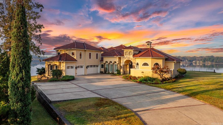 Welcome to your waterfront dream retreat nestled on 1.17 acre in established 800+ household community by Hurricane Lake! Situated on the best lot in the community over a 3-tiered terrace with 2-level massive seawalls, this spectacular custom masterpiece boasts unparalleled luxury and breathtaking panoramic 270-degree lake views. Its long driveways provide you with ample privacy and 20+ car parking capability. Step into a world of elegance and sophistication with 18 foot heavily trimmed ceilings. All rooms, kitchen and sitting areas enjoy open lake views. The chef's kitchen is a culinary delight, it includes top-of-the-line appliances, commercial grade ovens and a built-in Miele coffee maker, perfect for entertaining guests. The oversized master suite is a haven of comfort and the expansive ensuite bathroom let you indulge in the ultimate pampering experience, not to mention a 15'x23' huge his & her walk-in closet with custom cabinetry and wardrobe lifts. Large home theater upstairs with custom leather seating and high-quality theatre grade surround sound. The expansive verandas on both levels ensure you to enjoy the stunning lake views from multiple vantage points.