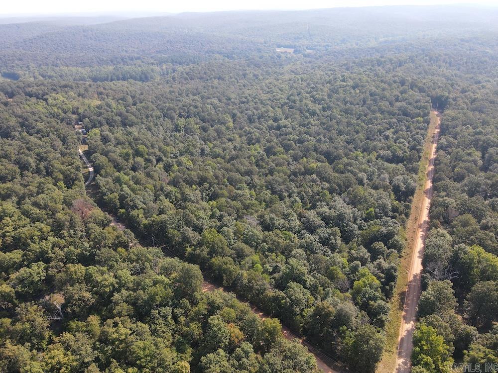 Nestled in the Ozarks, this Fulton County tract blends privacy, beauty, and accessibility. Featuring gently rolling terrain, mature marketable oaks, and abundant wildlife, itās perfect for hunters, nature lovers, or anyone seeking a peaceful retreat. Two well-maintained county gravel roads border the property, offering year-round access with electricity already in place. Multiple prime building sites provide options for a dream home or cabin with wooded views and tranquil surroundings. Wildlife is plentifulādeer, turkey, and small game are frequent visitorsāmaking it ideal for hunting or simply enjoying nature. Whether for recreation, homesteading, or investment, this property offers space, utilities, and valuable timber to bring your vision to life. Just a short drive from Cherokee Village, Hardy, Mammoth Spring, and the scenic Spring River, youāll enjoy nearby shops, dining, and outdoor adventures while savoring your private Ozark escape. Rarely does a property combine so many featuresādonāt miss this gem.