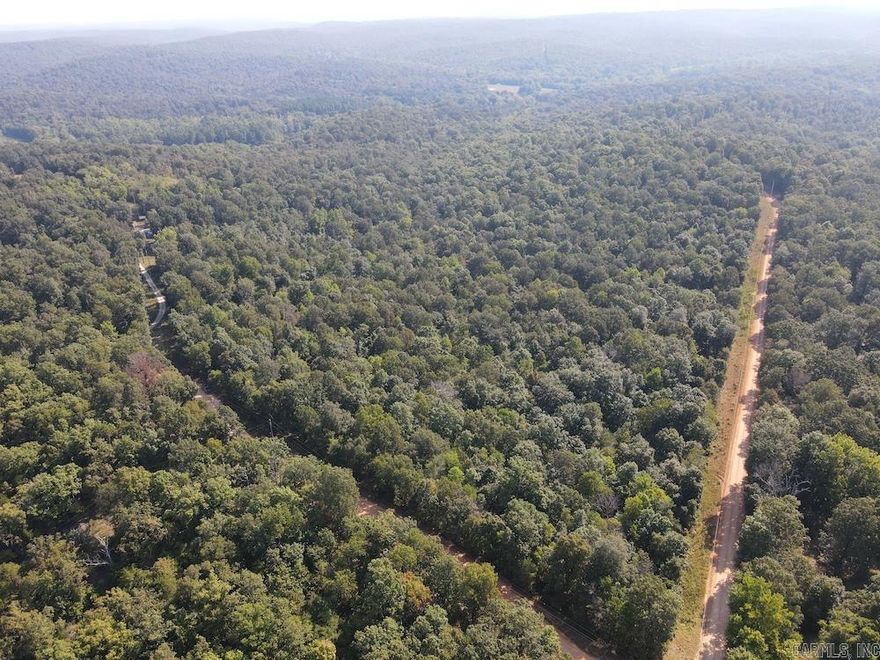 Nestled in the Ozarks, this Fulton County tract blends privacy, beauty, and accessibility. Featuring gently rolling terrain, mature marketable oaks, and abundant wildlife, it’s perfect for hunters, nature lovers, or anyone seeking a peaceful retreat. Two well-maintained county gravel roads border the property, offering year-round access with electricity already in place. Multiple prime building sites provide options for a dream home or cabin with wooded views and tranquil surroundings. Wildlife is plentiful—deer, turkey, and small game are frequent visitors—making it ideal for hunting or simply enjoying nature. Whether for recreation, homesteading, or investment, this property offers space, utilities, and valuable timber to bring your vision to life. Just a short drive from Cherokee Village, Hardy, Mammoth Spring, and the scenic Spring River, you’ll enjoy nearby shops, dining, and outdoor adventures while savoring your private Ozark escape. Rarely does a property combine so many features—don’t miss this gem.