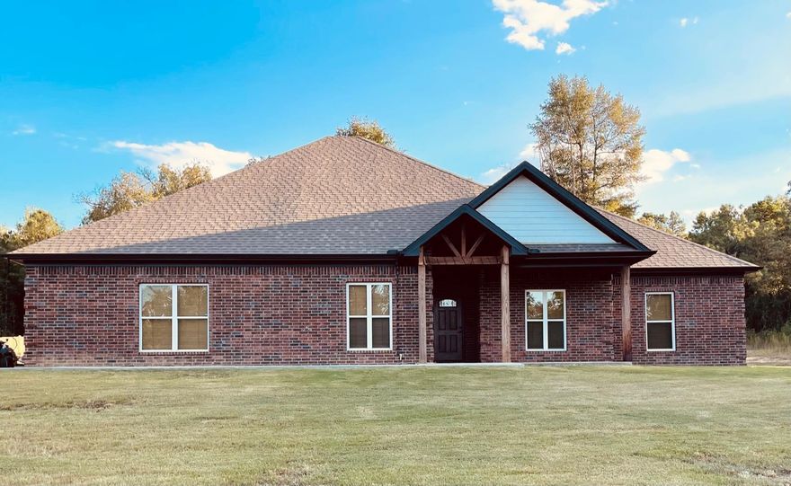 Beautiful traditional style home on a large lot with great privacy! This home is under 3.5 years old and has been very well maintained. 4 bed, 2 bath, plus laundry and separate dining room.  Huge master, master closet & bath caters to the owners! Deep soaker tub plus custom tile shower and double vanity. Open Kitchen / Living room plan with cozy gas fireplace. Granite countertops and luxury vinyl plank throughout. 9' ceilings w/ 10' trays, fiber internet, and gas tankless hwh. Storage galore! Tons of closet space throughout plus oversized garage & plenty of floored attic. The 12x28 covered porch is a dream, giving you additional outdoor living / entertaining space to cook, dine and hang overlooking your shaded, private back yard. Gas connection on back porch for your grill or Blackstone. Extra-large driveway, Home is wired for generator. Water, septic and electric connections on site for 2 50-amp campers or to build a shop!