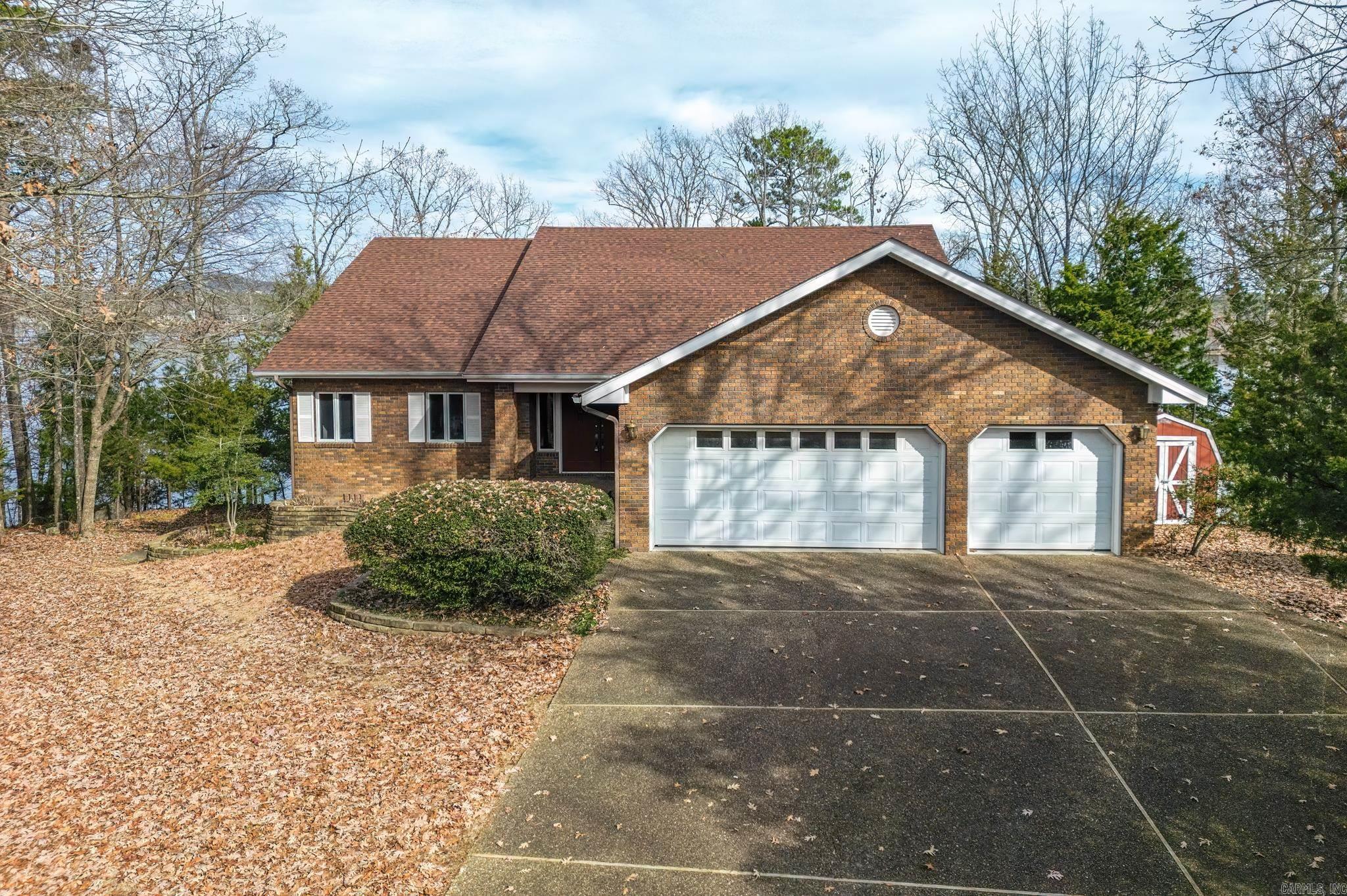 Lake Balboa waterfront with 220 feet of north/east facing shore on the Galeon Lane peninsula. This brick home will allow you to live on the main floor with a vaulted ceiling in the living/dining/kitchen area. Enjoy the lake view as you cook in the kitchen. Walk in pantry/storage for all your entertaining needs. Fireplace in living room open to dining room. There are two bedrooms with a primary bath between them. Laundry room and a half bath. Upper deck with screened porch for your outdoor enjoyment. The lower level features three bedrooms, full bath and a living area with a fireplace. Many options for an office or hobby area. Great space with inside and outside entrance for easy access to make a a perfect room for a hobby/workshop area. & storage galore. This home is perfect for entertaining both inside & outside. Covered boat dock w/lift and swim deck are ideal for enjoying lake front living. Water feature and patio. Sprinkler system lake fed. Oversized garage with additional storage area. No Sellers Disclosure. Agt rmks