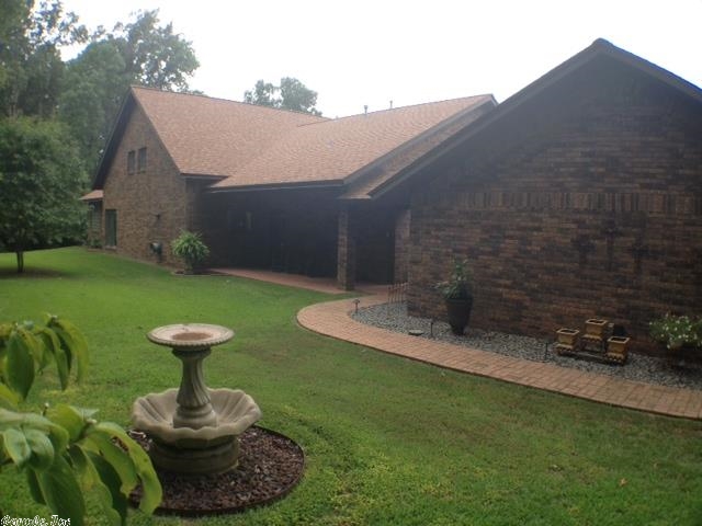 Fisherman and sportsman paradise! Fabulous custom built house on Lake Erling a 7500 acre privately owned lake in South Arkansas. Sitting on 1.72 acres this beautiful home is immaculate and will make a great retirement home, weekend home or private getaway for an avid sportsman. Located in a coveted neighborhood with only six homes and lots of privacy. With 320' lake frontage, retaining wall, fish cleaning shed, floating boat dock with boat lift, beautiful landscaping, and custom features throughout.