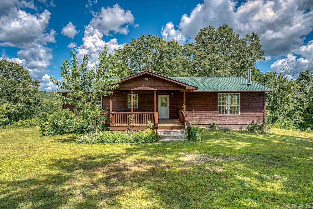 Nestled in the rolling hills of the Ozarks, this stunning 4-bed, 2-bath country home on 22 acres offers the perfect blend of rustic charm and modern comfort. Surrounded by a mix of lush pasture and mature timber, the property features a long, tree-lined drive, a cozy covered porch, and a spacious back deck with sweeping views, ideal for relaxing or entertaining. Inside, enjoy laminate flooring throughout, a large kitchen with ample cabinetry, two living rooms, an office, and a full finished basement with two bonus rooms. High-speed fiber internet makes remote work a breeze. The land is perfect for outdoor activities, livestock, or small-scale farming, with abundant wildlife and excellent hunting potential. A metal outbuilding offers great storage for equipment or hobbies. Located near the Buffalo National River, White River, Blanchard Springs, and Norfork Lake, this retreat offers unmatched access to fishing, hiking, and boating. Additional adjoining acreage available, donāt miss this rare Ozark gem!